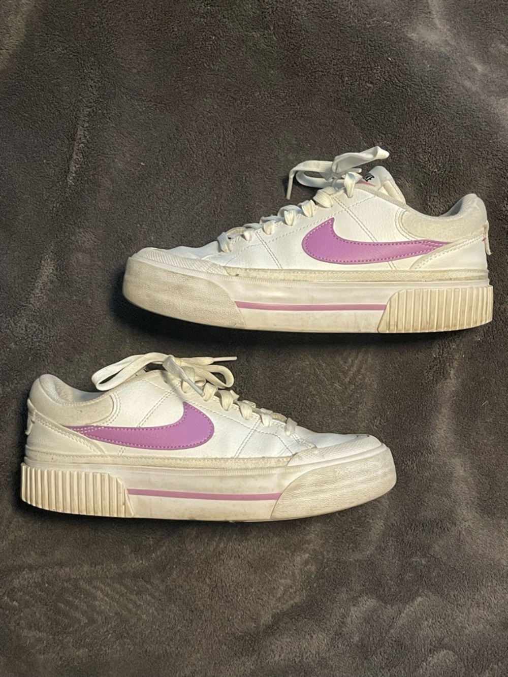 Nike Women's White Sneakers with Purple Swoosh